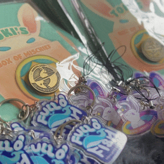 Unravel keychains, pins, and stickers